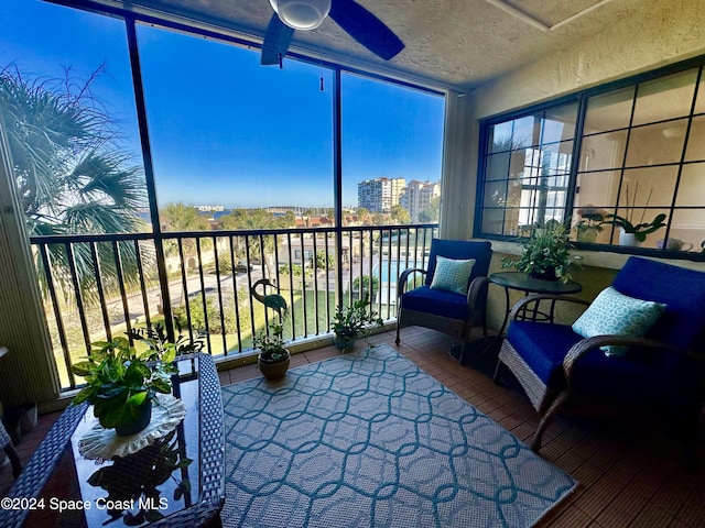 sunroom with ceiling fan and plenty of natural light