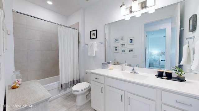 full bathroom with vanity, toilet, and shower / bathtub combination with curtain