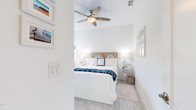 bedroom featuring ceiling fan and light hardwood / wood-style floors