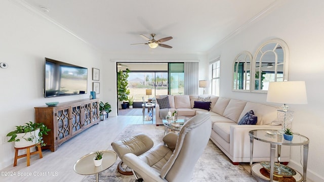 living room with ceiling fan and ornamental molding