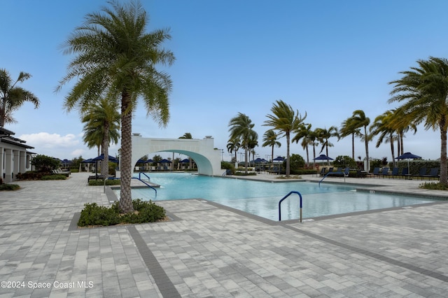 view of swimming pool featuring a patio area and a water slide