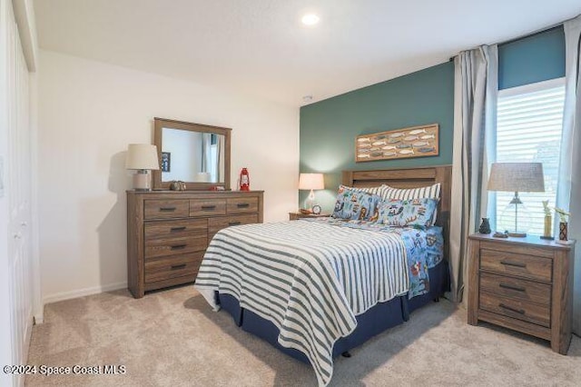 bedroom with light colored carpet