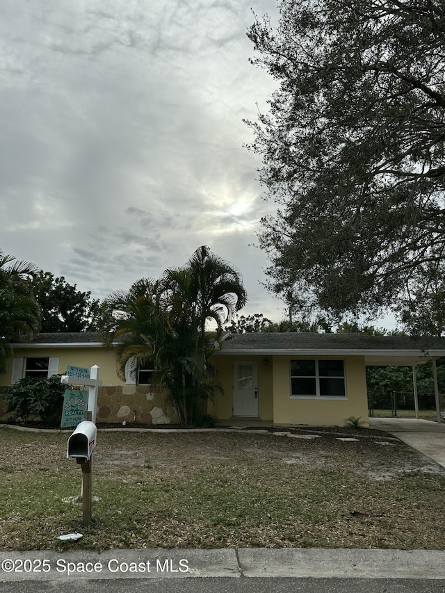 view of front of property with a carport