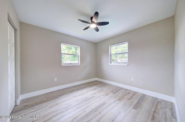 spare room with ceiling fan and light hardwood / wood-style flooring