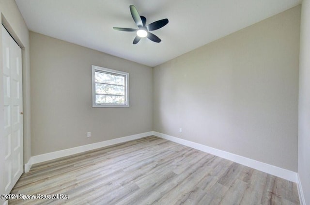 spare room with ceiling fan and light hardwood / wood-style floors