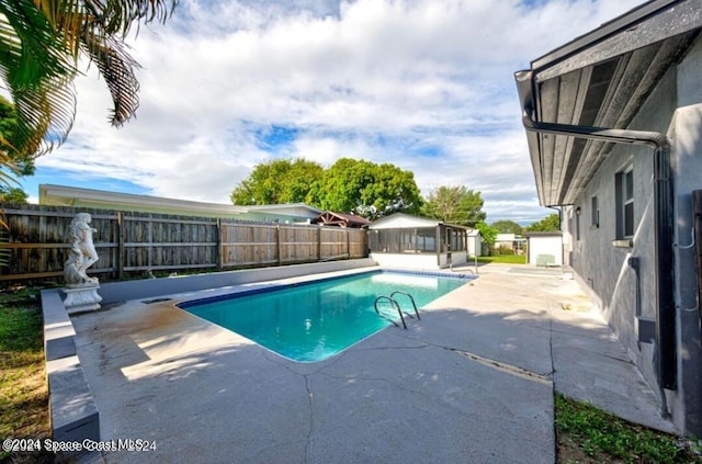 view of swimming pool with a patio