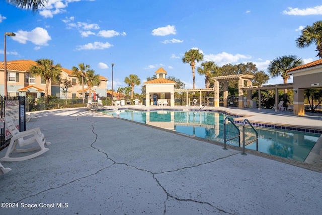 view of swimming pool with a patio area