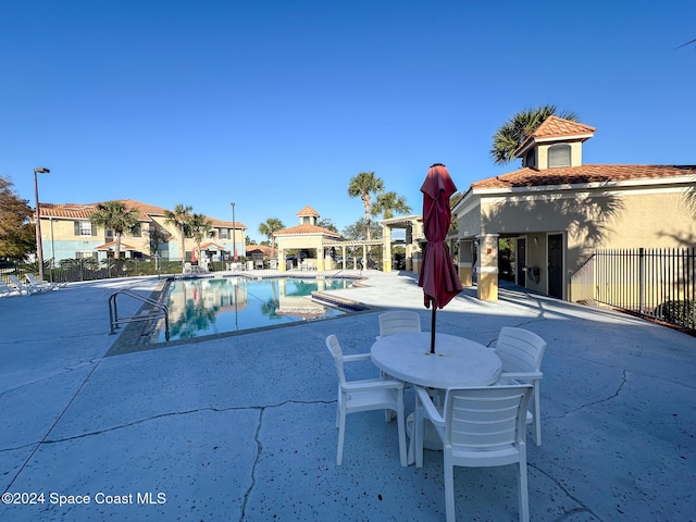 view of swimming pool with a patio area