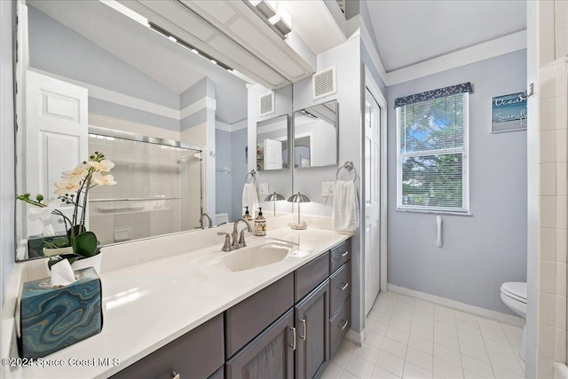 bathroom with vanity, lofted ceiling, tile patterned flooring, toilet, and a shower with shower door