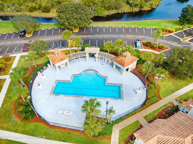 view of pool with a water view