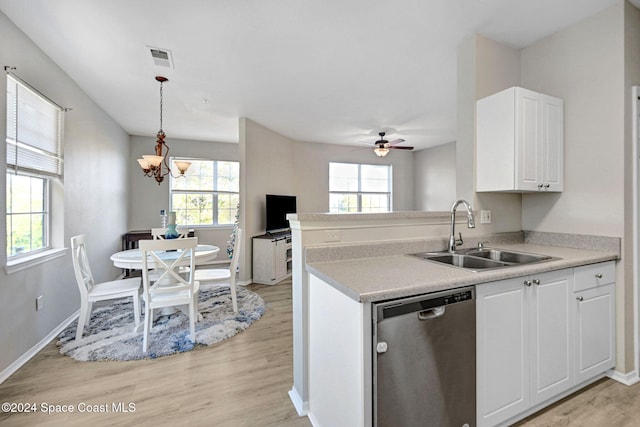 kitchen featuring stainless steel dishwasher, white cabinets, light wood-type flooring, and sink