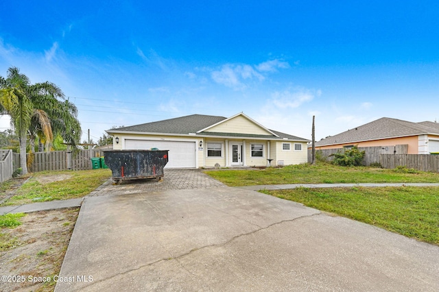 view of front facade with a garage and a front yard