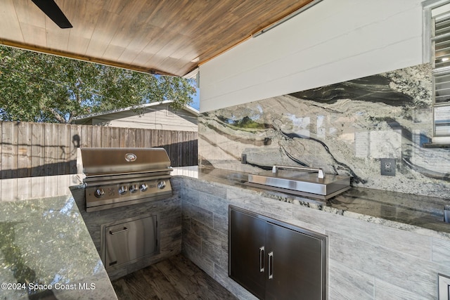 view of patio / terrace featuring area for grilling and an outdoor kitchen