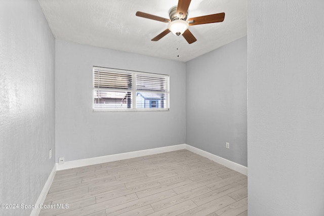 unfurnished room with ceiling fan, light hardwood / wood-style floors, and a textured ceiling