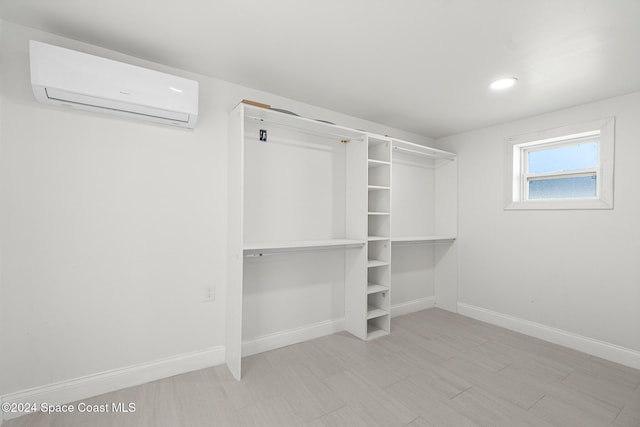 spacious closet with a wall mounted air conditioner