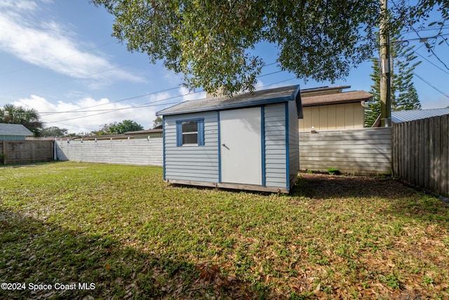 view of outbuilding with a lawn