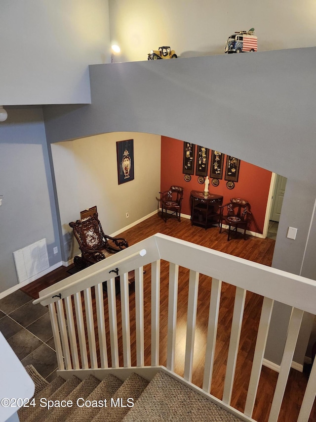 stairs featuring hardwood / wood-style flooring