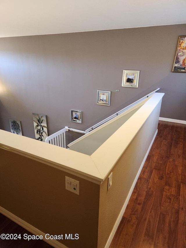 stairway with hardwood / wood-style flooring