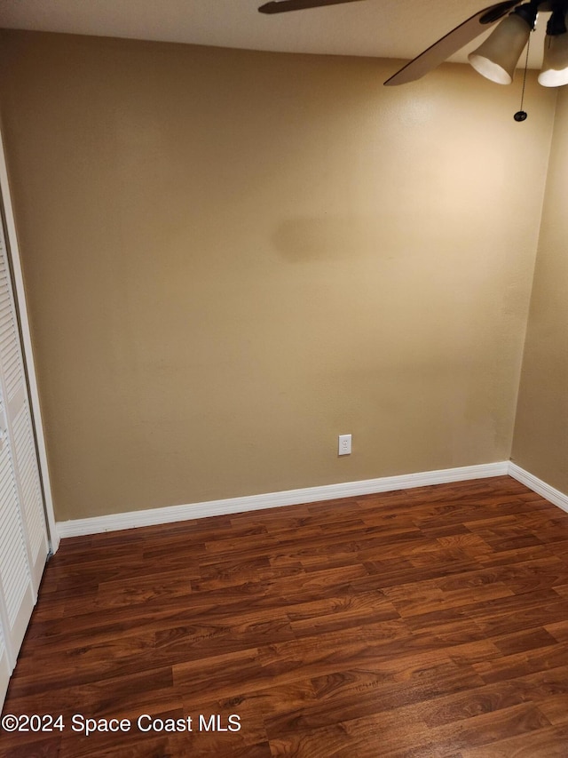 unfurnished room featuring dark hardwood / wood-style flooring and ceiling fan