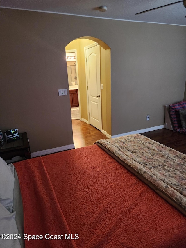 bedroom with hardwood / wood-style floors