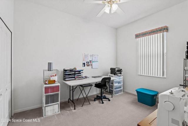 carpeted office space with ceiling fan