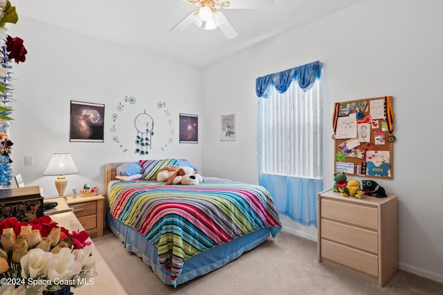 carpeted bedroom with ceiling fan