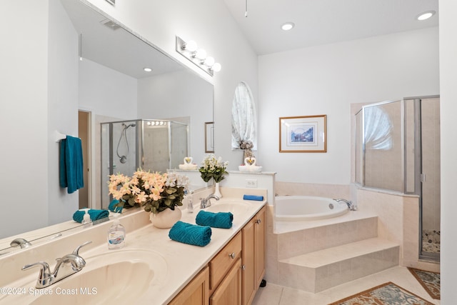 bathroom featuring vanity, tile patterned floors, and separate shower and tub