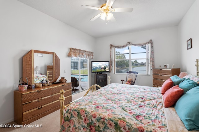 carpeted bedroom with access to outside and ceiling fan