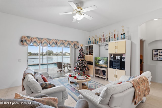 tiled living room featuring ceiling fan