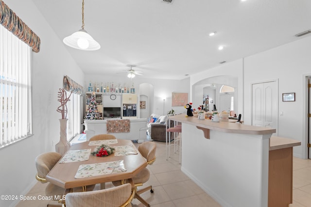 dining area featuring light tile patterned floors and ceiling fan