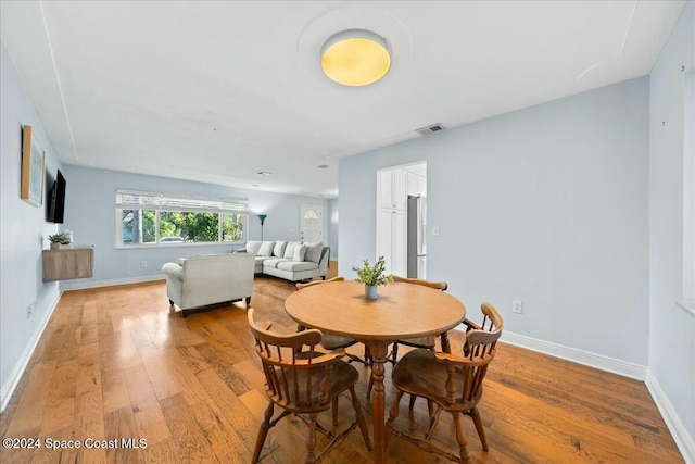 dining room featuring light wood-type flooring