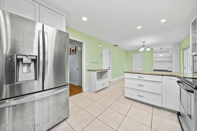 kitchen featuring white cabinets, light stone countertops, stainless steel appliances, and light tile patterned floors