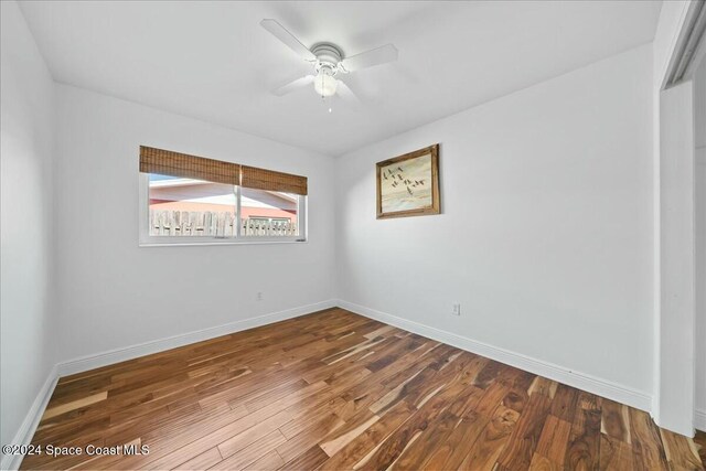 unfurnished room with hardwood / wood-style flooring and ceiling fan