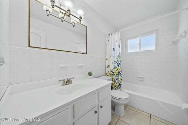 full bathroom with tile patterned floors, vanity, shower / tub combo with curtain, tile walls, and toilet