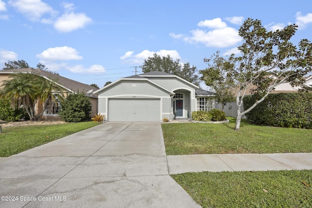 single story home featuring a garage and a front yard