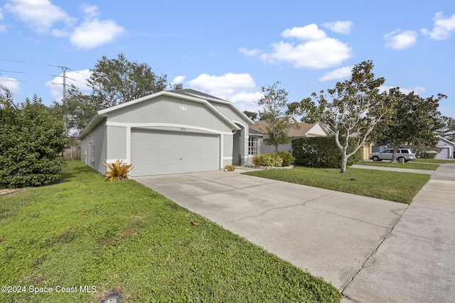 view of front facade featuring a garage and a front yard