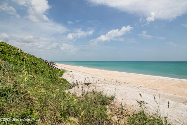 property view of water featuring a beach view