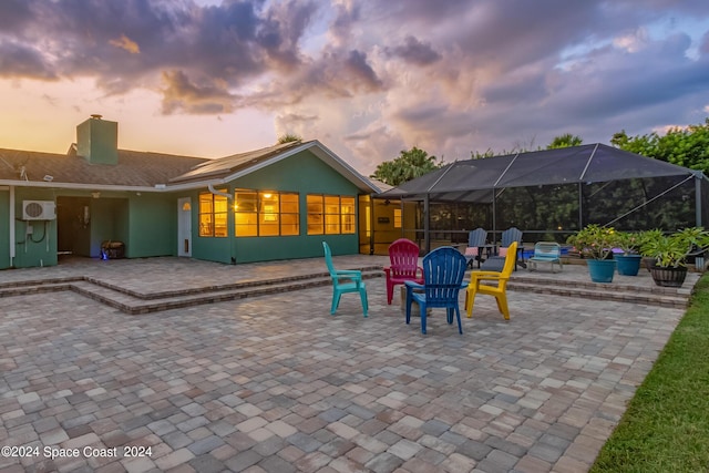 patio terrace at dusk with glass enclosure