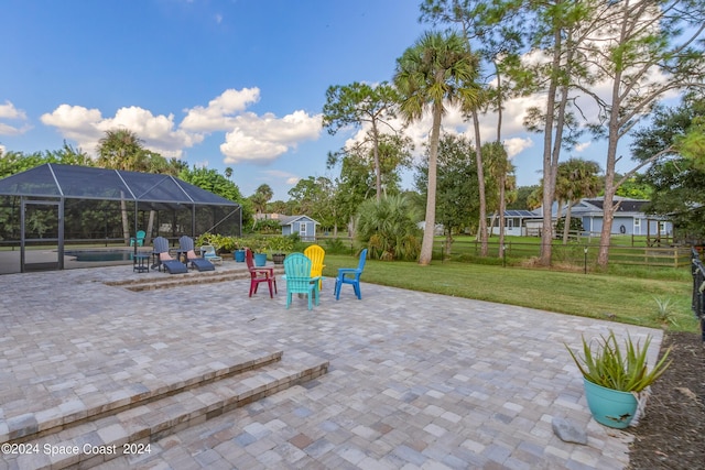 view of patio / terrace featuring a lanai and a pool