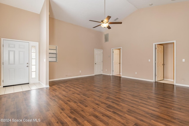 867 S Patrick Dr, Satellite Beach, FL 32937 - unfurnished living room featuring high vaulted ceiling, ceiling fan, and wood finished floors