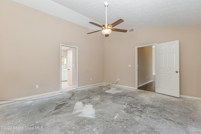 867 S Patrick Dr, Satellite Beach, FL 32937 - unfurnished bedroom featuring ensuite bathroom and a textured ceiling