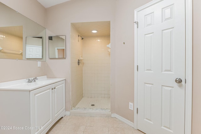 867 S Patrick Dr, Satellite Beach, FL 32937 - full bathroom featuring vanity, a shower stall, and tile patterned flooring