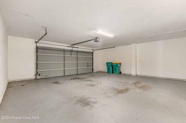 867 S Patrick Dr, Satellite Beach, FL 32937 - garage featuring a garage door opener