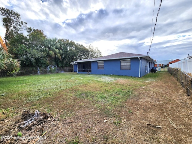 view of yard featuring a sunroom