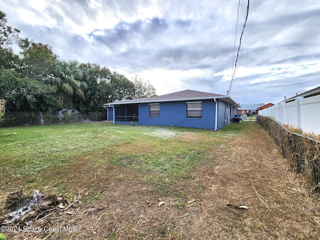 view of yard featuring a sunroom