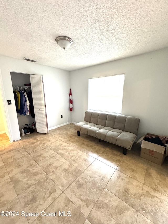 living room featuring a textured ceiling