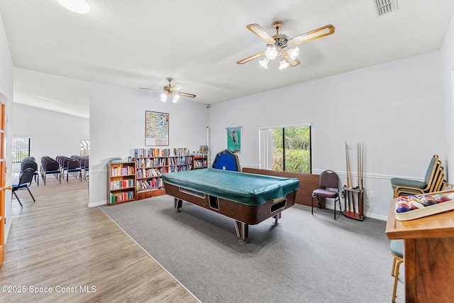 recreation room featuring ceiling fan, pool table, a textured ceiling, and light wood-type flooring