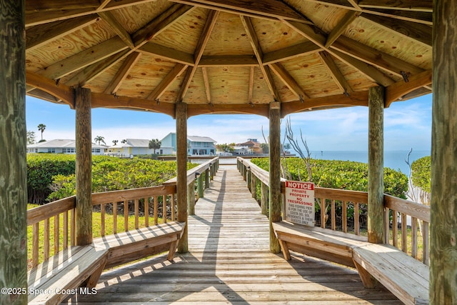 view of dock featuring a gazebo and a water view