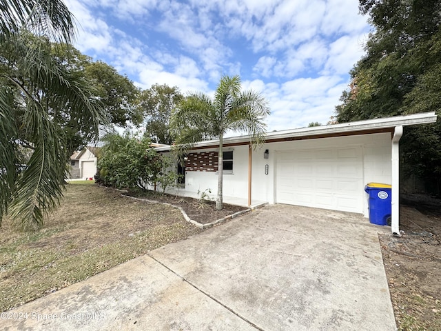 single story home featuring a garage