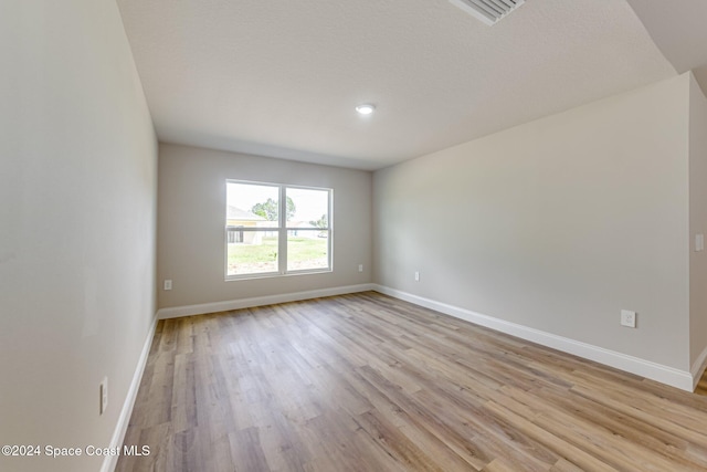 empty room featuring light hardwood / wood-style floors